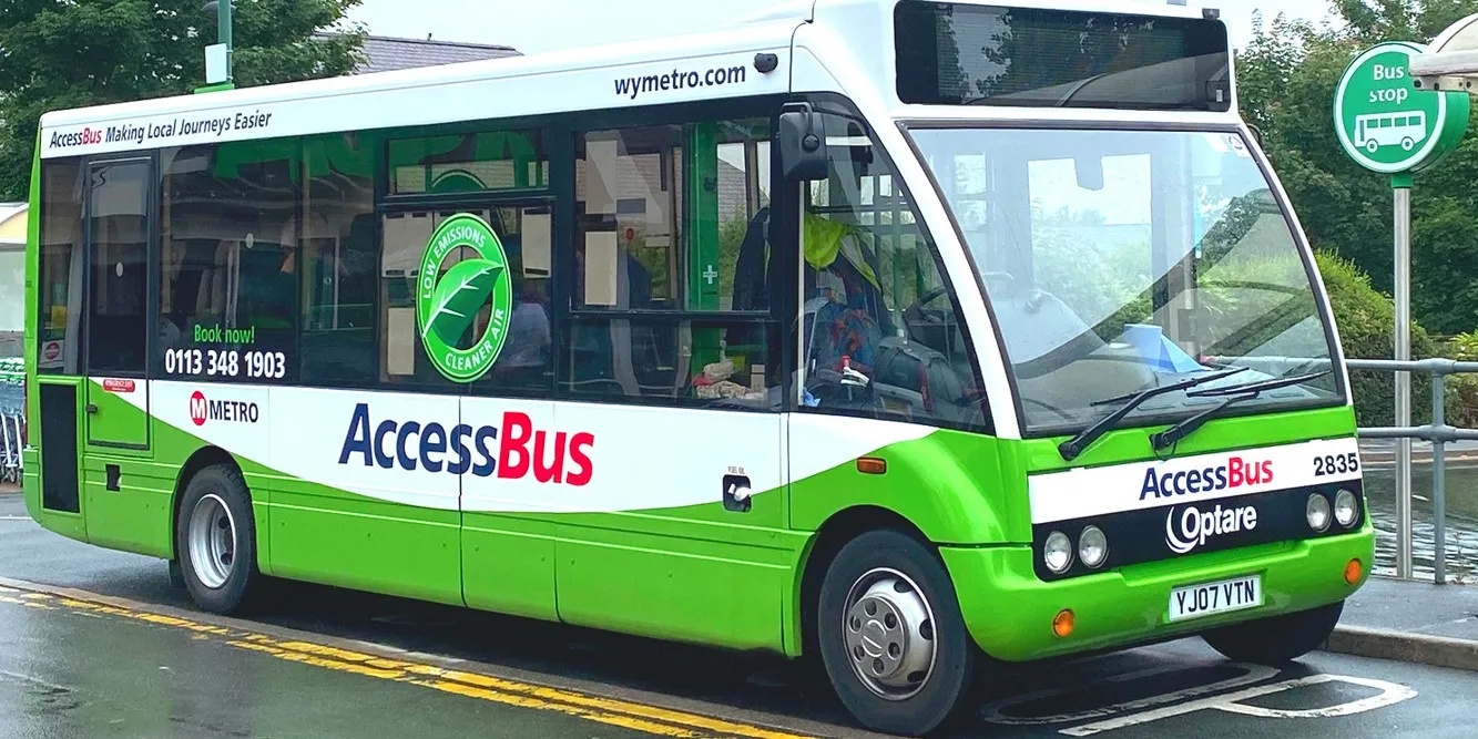 The green and white WY Metro AccessBus.